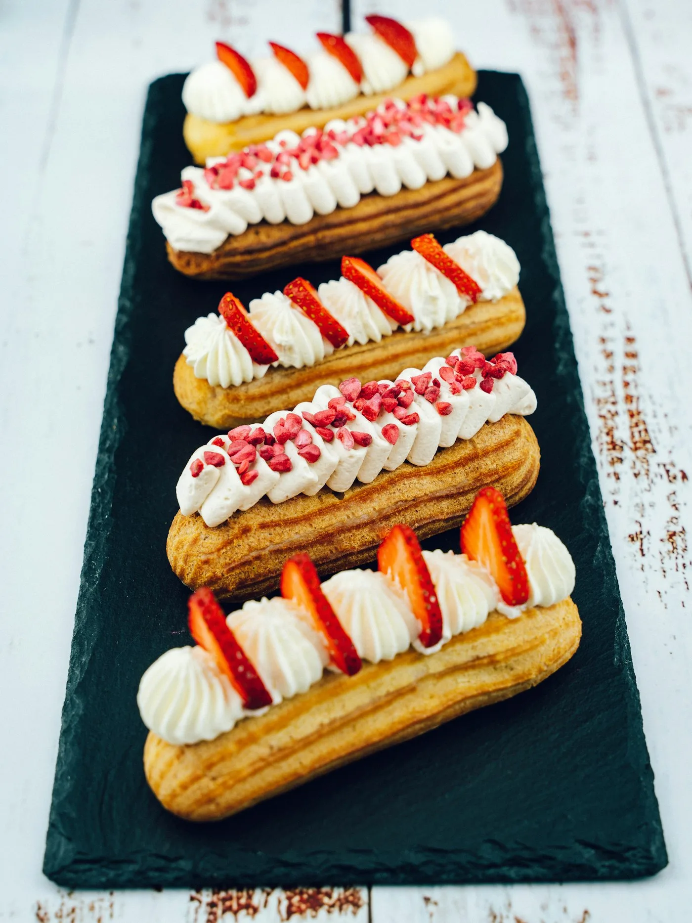 Tray of eclairs and choux pastries